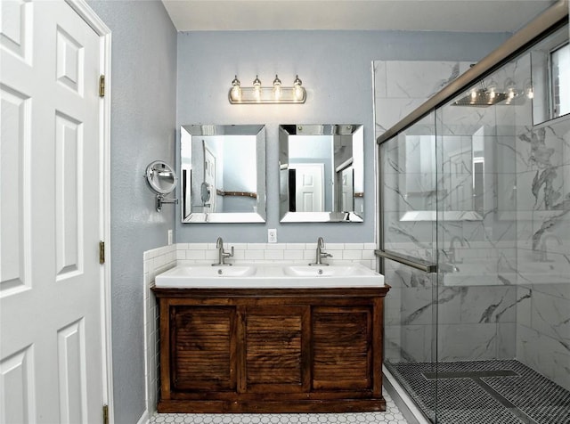 bathroom featuring walk in shower and vanity