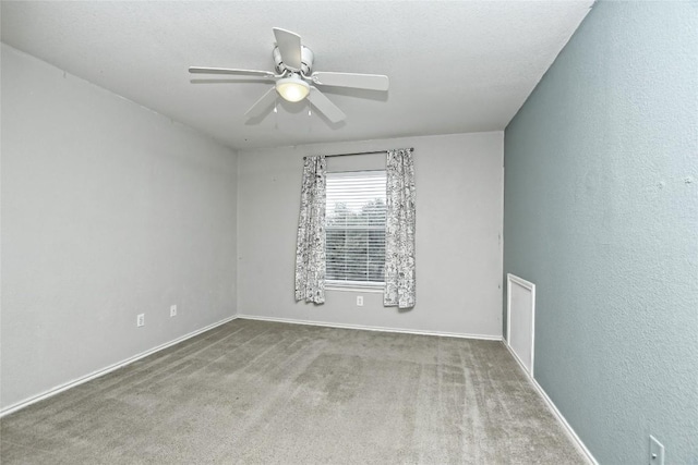 empty room with carpet floors and ceiling fan