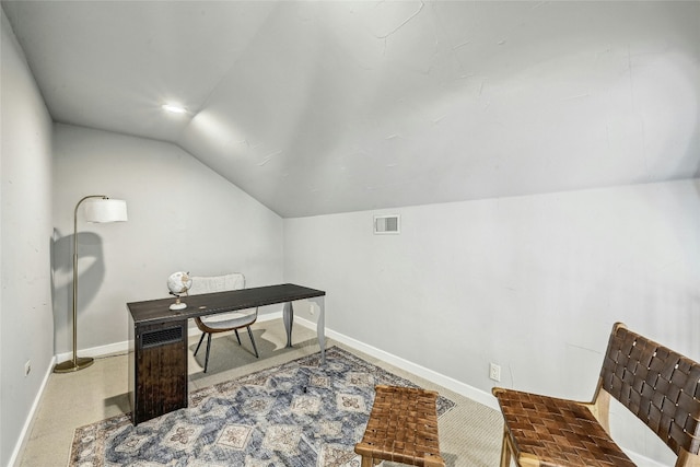 office area with lofted ceiling and carpet floors