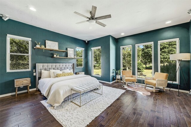 bedroom with ceiling fan and dark hardwood / wood-style floors