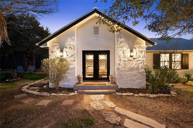 entrance to property featuring french doors