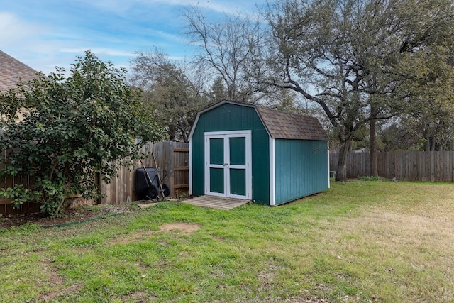 view of outbuilding with a yard