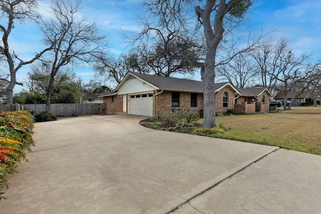 view of front of property featuring a garage and a front yard