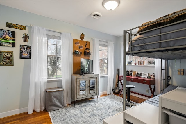 bedroom with light wood-type flooring