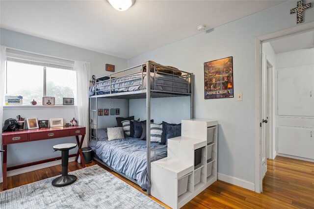 bedroom with hardwood / wood-style flooring