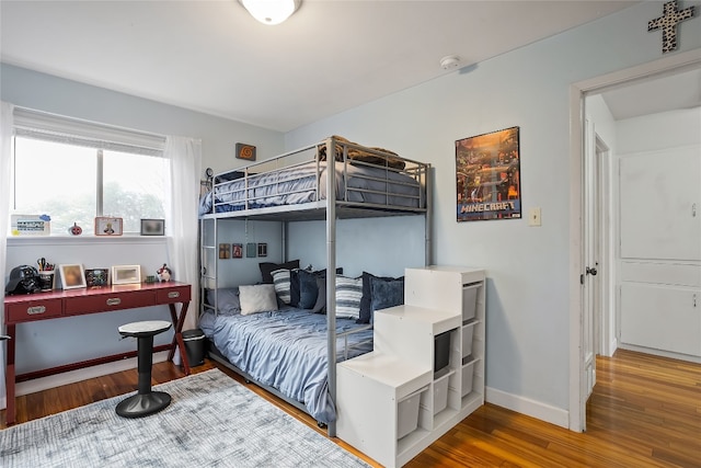 2502 Spruceleaf Cir, Austin, TX 78757 - bedroom featuring wood finished floors and baseboards