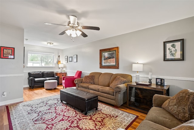 living room with ceiling fan and light wood-type flooring