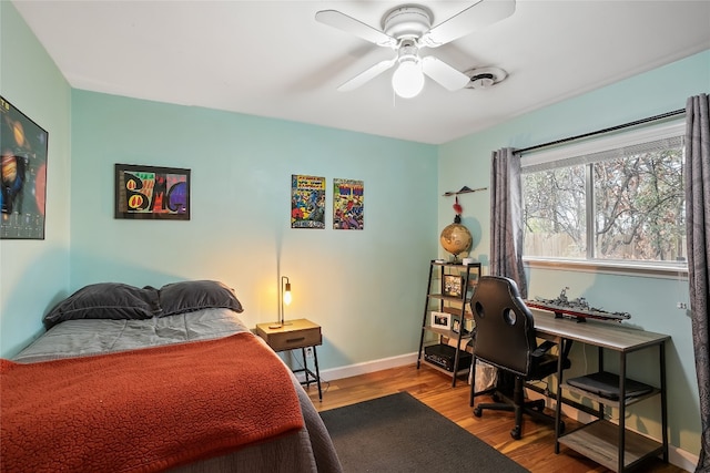 bedroom with light hardwood / wood-style flooring and ceiling fan