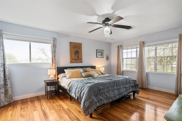 bedroom featuring ceiling fan and light wood-type flooring