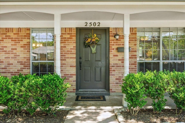 2502 Spruceleaf Cir, Austin, TX 78757 - view of exterior entry with brick siding and covered porch