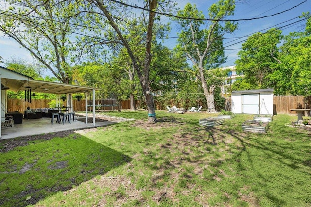 2502 Spruceleaf Cir, Austin, TX 78757 - view of yard with a patio, a storage shed, an outbuilding, an outdoor hangout area, and a vegetable garden