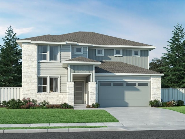 view of front of home with a garage and a front yard