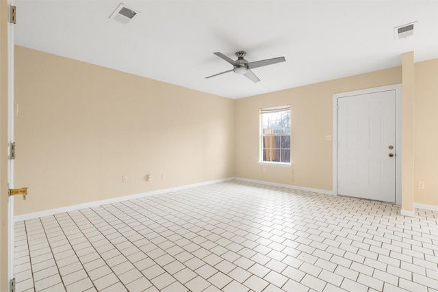 unfurnished room featuring ceiling fan and light tile patterned floors