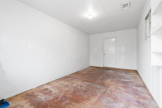 empty room with concrete flooring