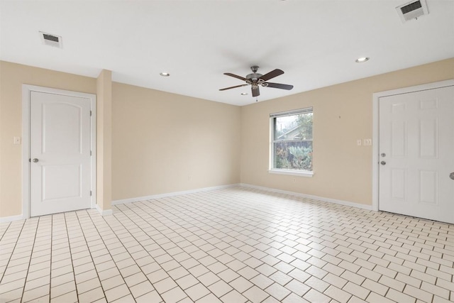 unfurnished room featuring ceiling fan and light tile patterned floors