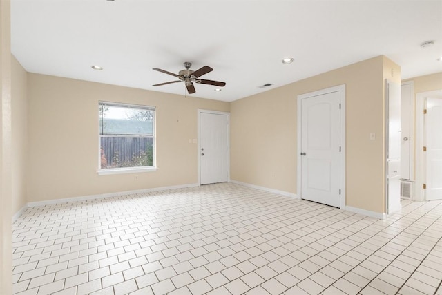 unfurnished room with light tile patterned floors and ceiling fan