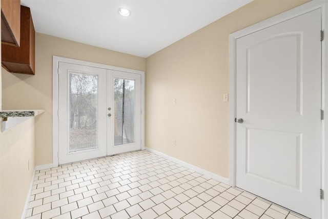 unfurnished dining area featuring french doors