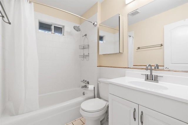 full bathroom with vanity, toilet, and shower / tub combo