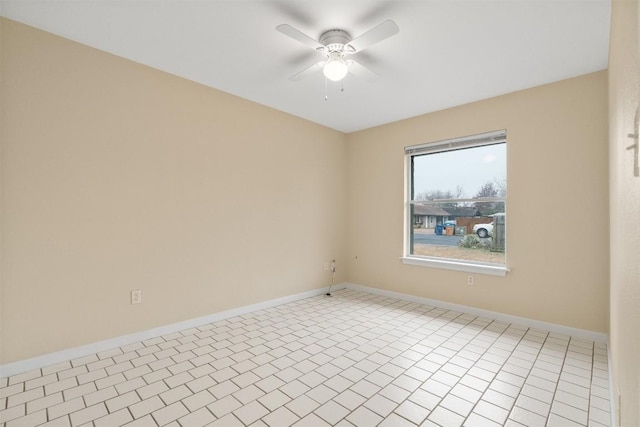 tiled empty room with ceiling fan