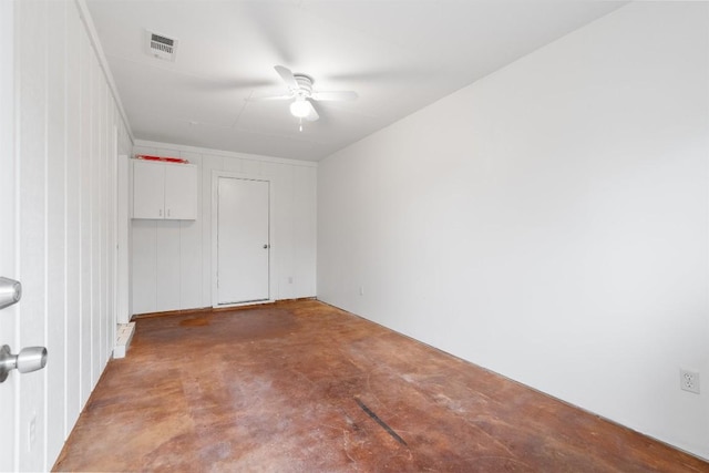 spare room with concrete flooring and ceiling fan