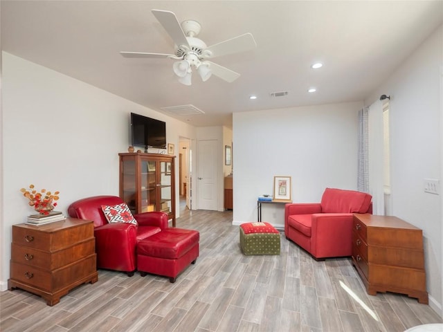 sitting room with ceiling fan