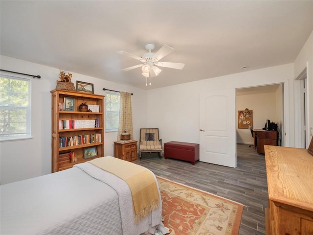 bedroom featuring dark hardwood / wood-style floors and ceiling fan