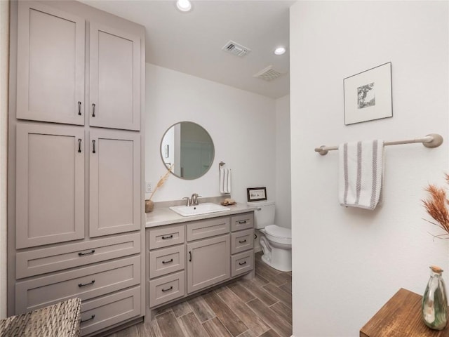 bathroom with vanity and toilet