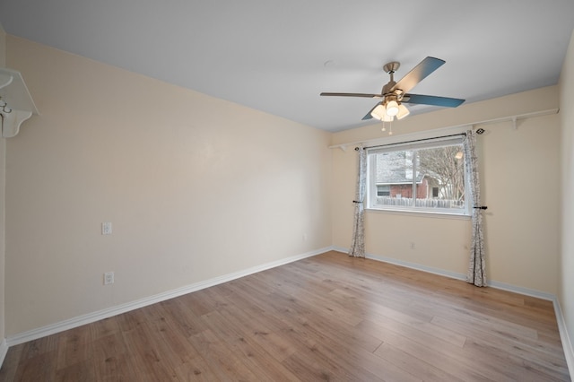 unfurnished room with ceiling fan and light hardwood / wood-style flooring