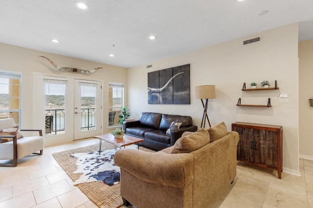living room with baseboards, french doors, recessed lighting, and visible vents