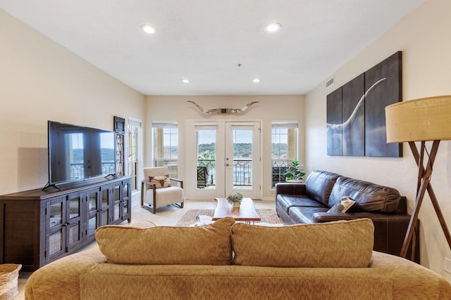 living room featuring recessed lighting and visible vents