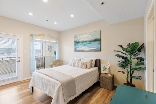 bedroom with light wood-type flooring, recessed lighting, baseboards, and access to outside