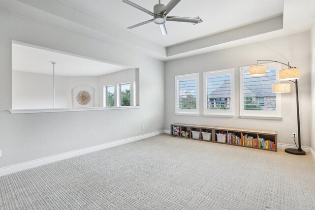 empty room with carpet and ceiling fan