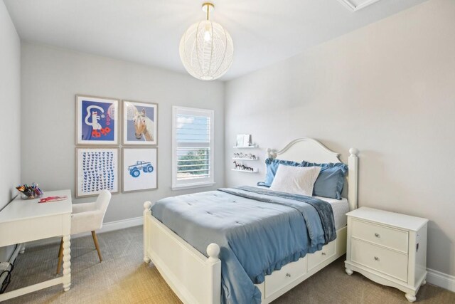 bedroom with light colored carpet