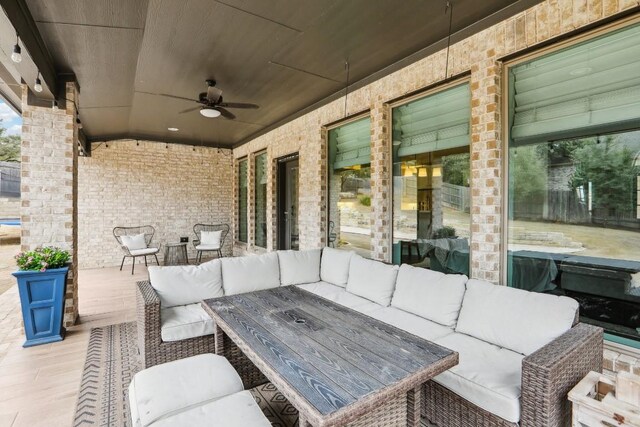 view of patio / terrace featuring an outdoor living space and ceiling fan