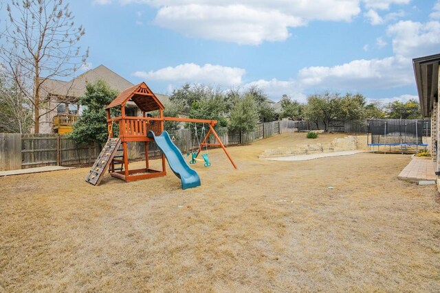 view of jungle gym with a trampoline