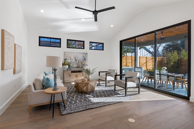 living area featuring ceiling fan, high vaulted ceiling, and hardwood / wood-style floors