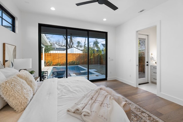 bedroom featuring multiple windows, ceiling fan, access to exterior, and light hardwood / wood-style floors