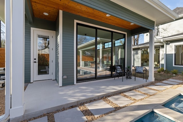 property entrance with a patio area