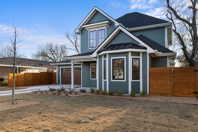 view of front of house featuring a garage and a front yard