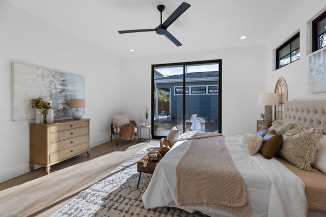 bedroom with access to exterior, hardwood / wood-style flooring, and ceiling fan