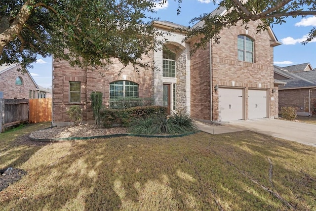 view of front of property with a garage and a front yard