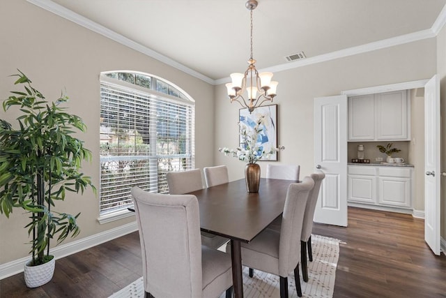 dining space featuring an inviting chandelier, ornamental molding, and dark hardwood / wood-style floors