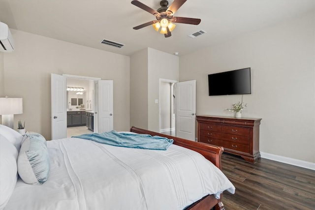 bedroom with ceiling fan, dark hardwood / wood-style flooring, and ensuite bath