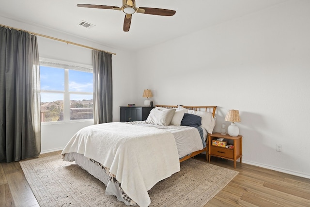 bedroom featuring ceiling fan and light hardwood / wood-style flooring