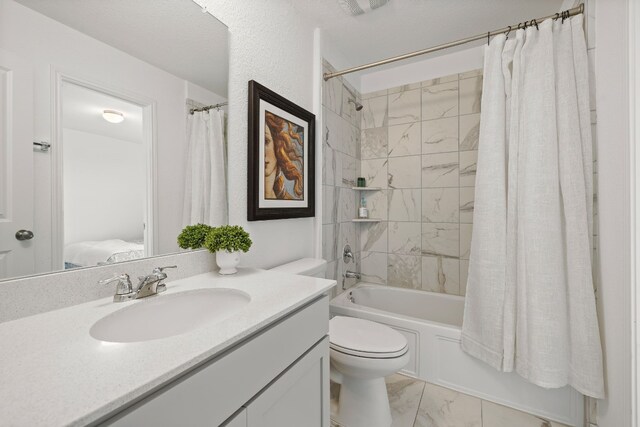 full bathroom with vanity, shower / bath combination with curtain, and toilet