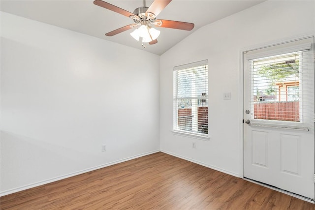 interior space with lofted ceiling, ceiling fan, and light hardwood / wood-style flooring