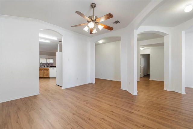 spare room with crown molding, light hardwood / wood-style flooring, and ceiling fan