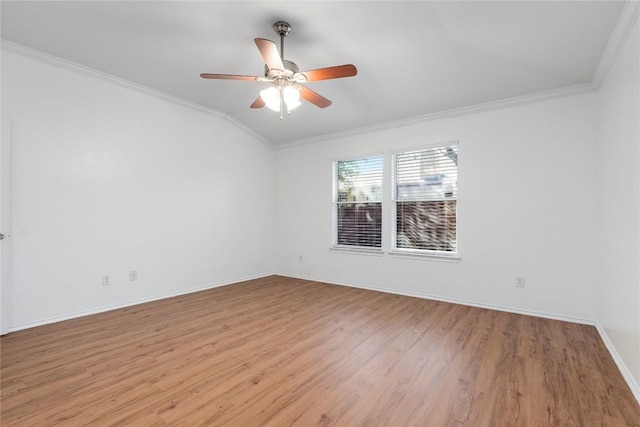 unfurnished room with crown molding, ceiling fan, lofted ceiling, and light wood-type flooring