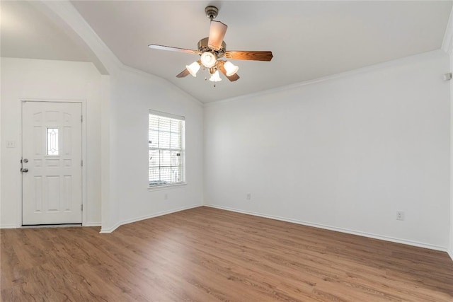 foyer featuring vaulted ceiling, crown molding, ceiling fan, and light hardwood / wood-style floors