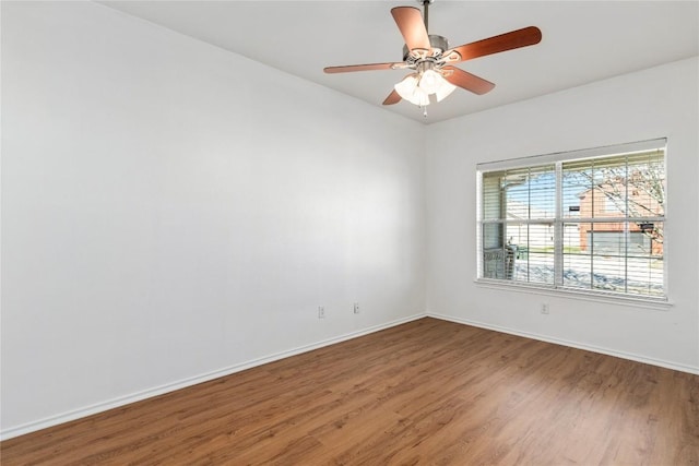 empty room with wood-type flooring and ceiling fan